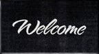 Durable Nylon Twist Pile Welcome Mat with Rubber Backing Black Mat With Grey Text 85 x 150cm