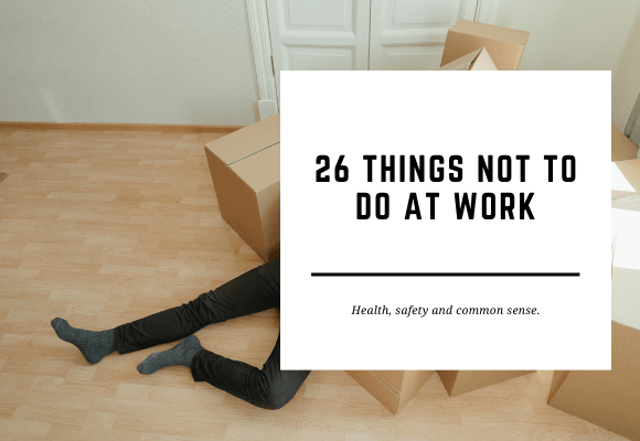 A man in a suit is lying underneath a pile of cardboard boxes. The blog header reads 26 Things Not to Do at Work.