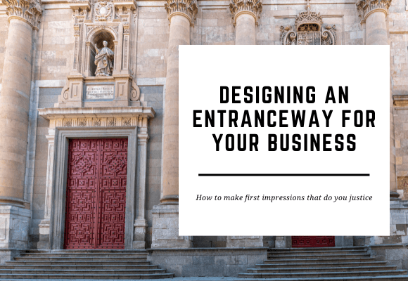 The red door to a historic building is set amongst white a brown bricks. The blog header reads Designing an Entranceway for Your Business.