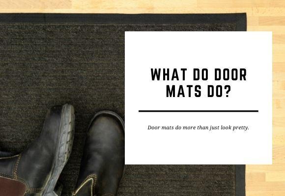 A pair of shoes lay on a black door mat on a wooden floor. The blog header reads What Do Door Mats Do?